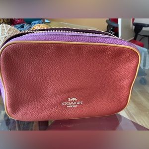 Coach double zip plum and coral crossbody or one shoulder purse.